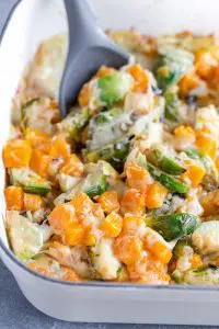 Butternut Squash Brussels Sprout Gratin with a Spoon Inside the Gratin