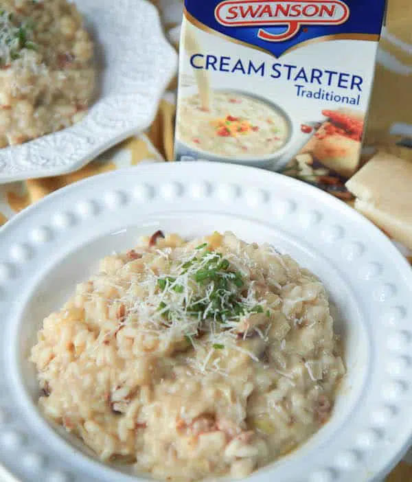 Leek and Pancetta Risotto - Extra Creamy! Served in a White Plate with a Pack of Crema Starter Traditional Alongside