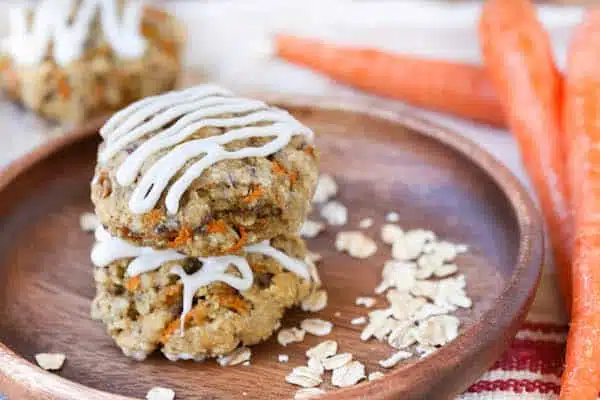 Carrot Cake Breakfast Cookies Beautiful Closeup with Carrots on the Side Blurred by the Camera