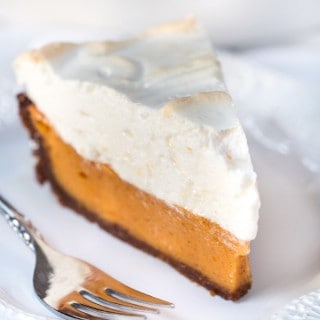 Sweet Potato Pie with Bourbon Meringue served with a fork on a white plate