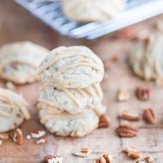 Butter Pecan Maple Cookies stacked on top of each other on the table