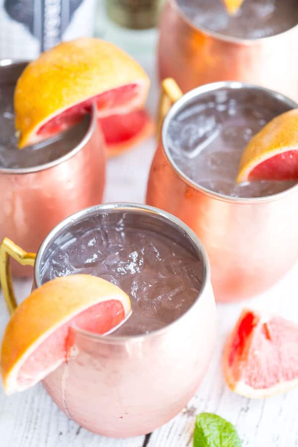 Grapefruit Moscow Mules - Four Jars with Grapefruit Pieces All Over