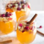 Apple Cider Bourbon Sangria - Served on the Table with a Cinnamon Stick