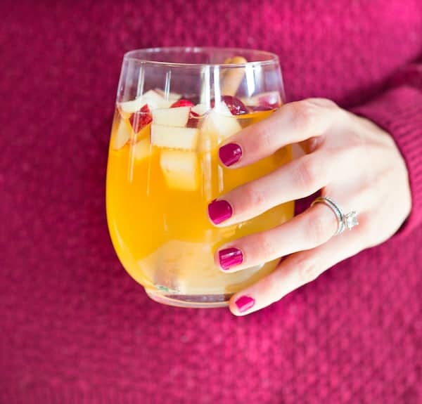 Apple Cider Bourbon Sangria - Holding in the Hand a Full Glass