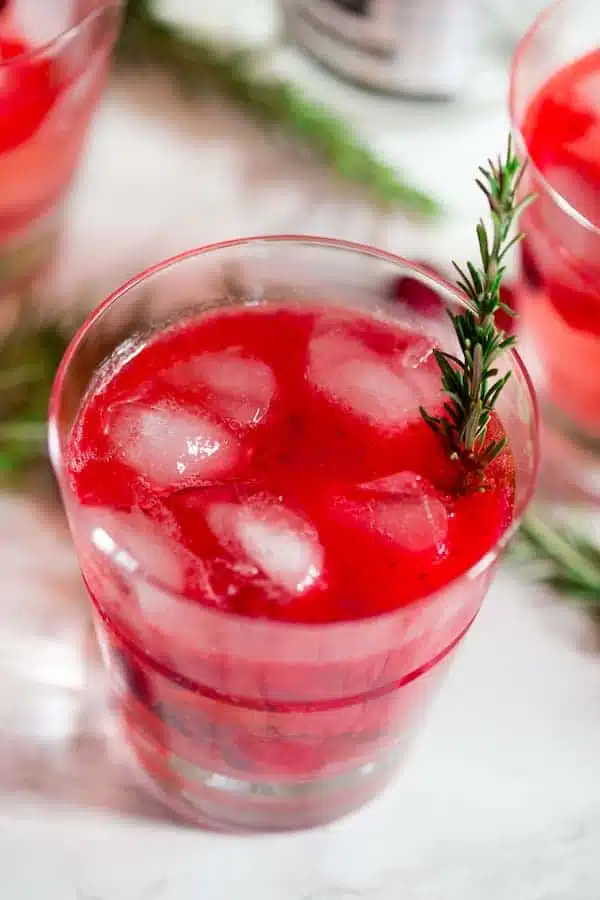 Cranberry Sauce Vodka Smash with Rosemary Decoration in a Glass