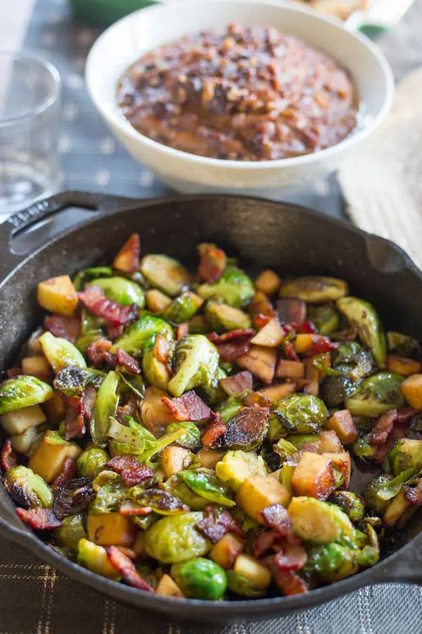 Maple Bacon Brussels Sprout Skillet with Other Dishes on the Table
