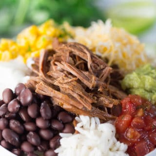Slow Cooker Barbacoa Beef Burrito Bowls - Focus and Closeup on the Meal in a White Bowl