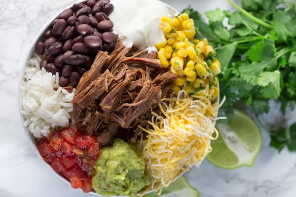 Slow Cooker Barbacoa Beef Burrito Bowls - Shot from the Top on the Bowl on the Table