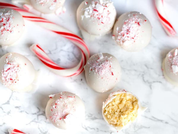 Beautiful White Chocolate Peppermint Oreo Truffles overhead shot with candy canes in between