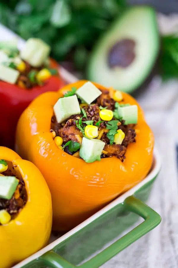 Mexican Chicken and Quinoa Stuffed Peppers - Focus on the Front Yellow Pepper Stuffed with Deliciousness of the Meal