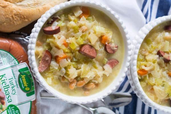 Slow Cooker Kielbasa and Cabbage Soup Overhead on Two Bowls of Soup and Jennie-O Turkey Kielbasa