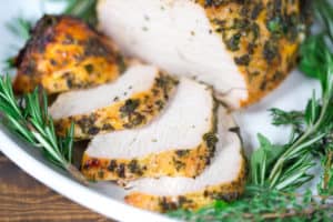 Herb Butter Roasted Turkey Breast Served with Cut Pieces of Flavorful Turkey