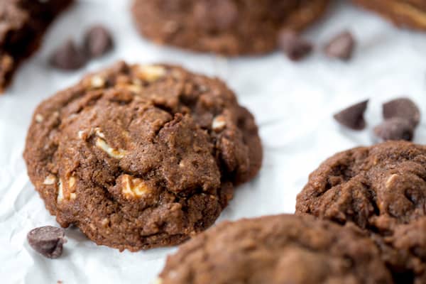 One of the Triple Chocolate Cookies is in focus with others - blurred in the background
