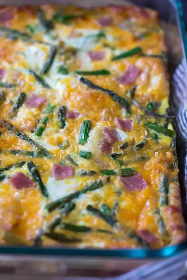 Ham Asparagus and Cheese Crescent Roll Breakfast Casserole Closeup on the Meal Before Serving into Plates