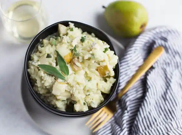 Pear and Gorgonzola Risotto Overhead with the Pear, Fork and Other Elements in One Composition