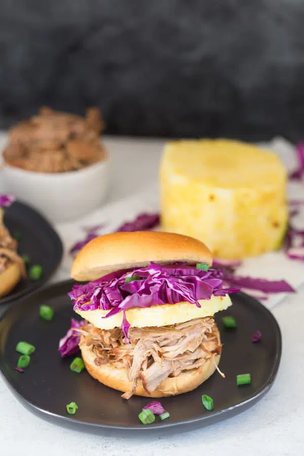 Pressure Cooker Hawaiian Pulled Pork Sandwiches Served on the Dark Plate with the Dark Grey Background
