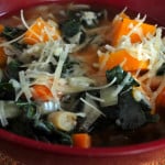 Butternut Squash and Kale Minestrone in a Red Bowl on the Table