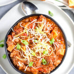 Instant Pot Turkey Quinoa Chili Overhead Shot on the Dish Served in a Dark Bowl with a Spoon Next to It