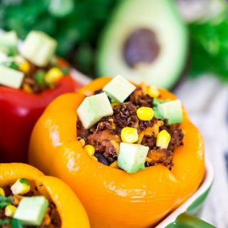 Mexican Chicken and Quinoa Stuffed Peppers - Focus on the Front Yellow Pepper Stuffed with Deliciousness of the Meal