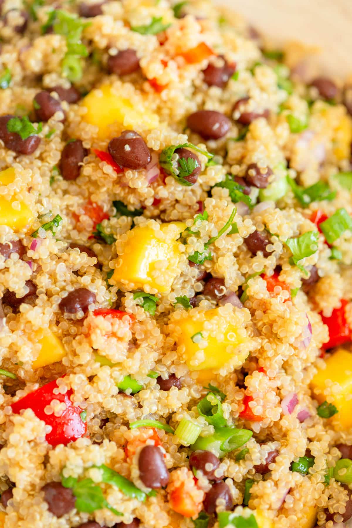 Mango Black Bean Quinoa Salad in a cream colored bowl.