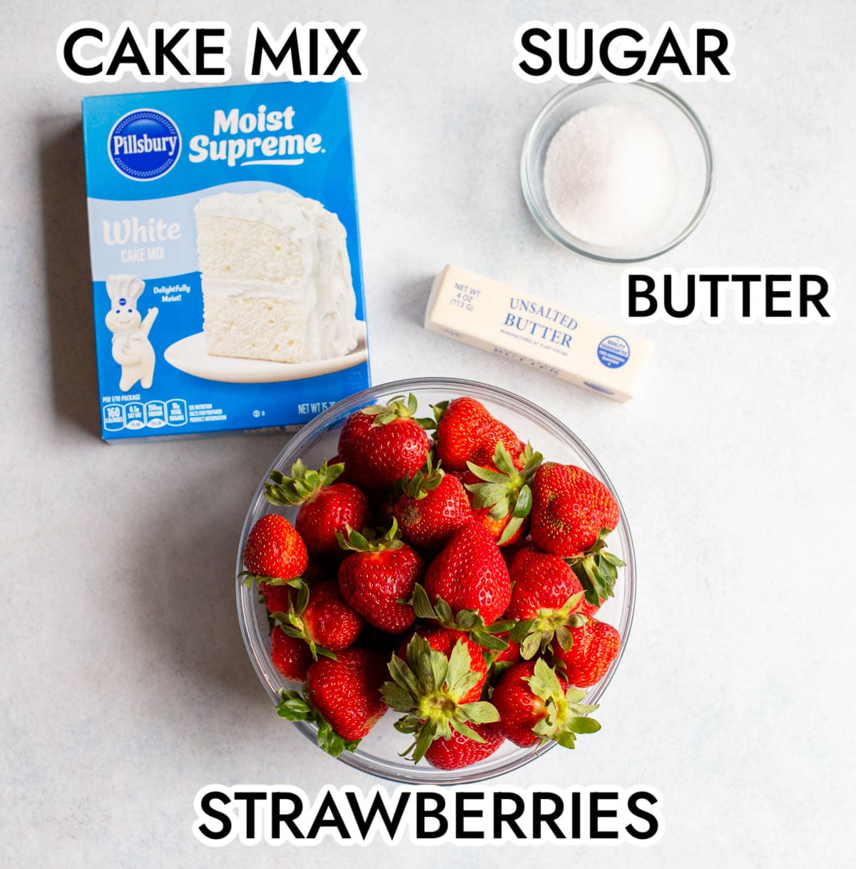 Strawberry Dump Cake Ingredients on a light gray background.
