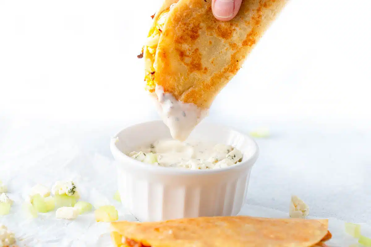 Buffalo Chicken Taco dipped in blue cheese sauce.
