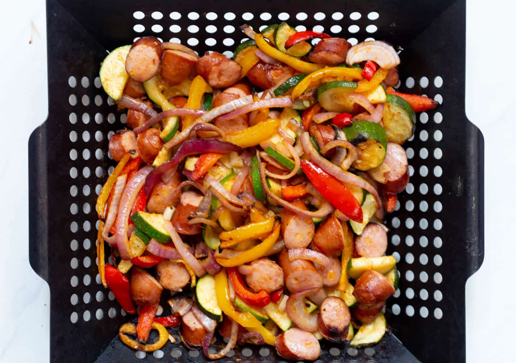 Grilled Cheddar Sausage and Pepper Skillet in a grill pan.