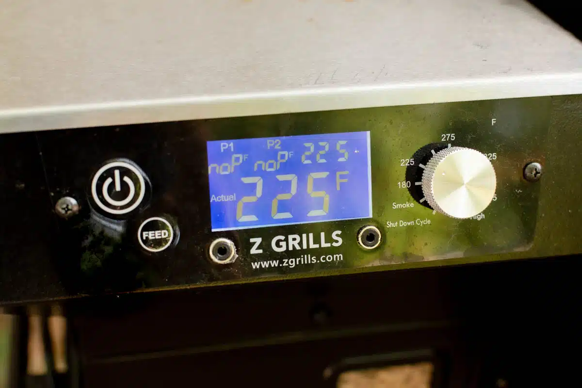 Digital screen on pellet smoker with the temperature at 225 degrees F. 