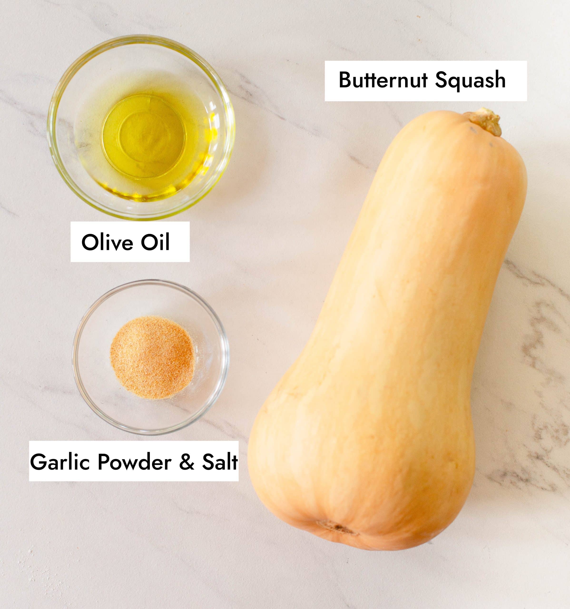 Ingredients in Air Fryer Butternut Squash, including a whole butternut squash, olive oil, garlic powder, and salt. 