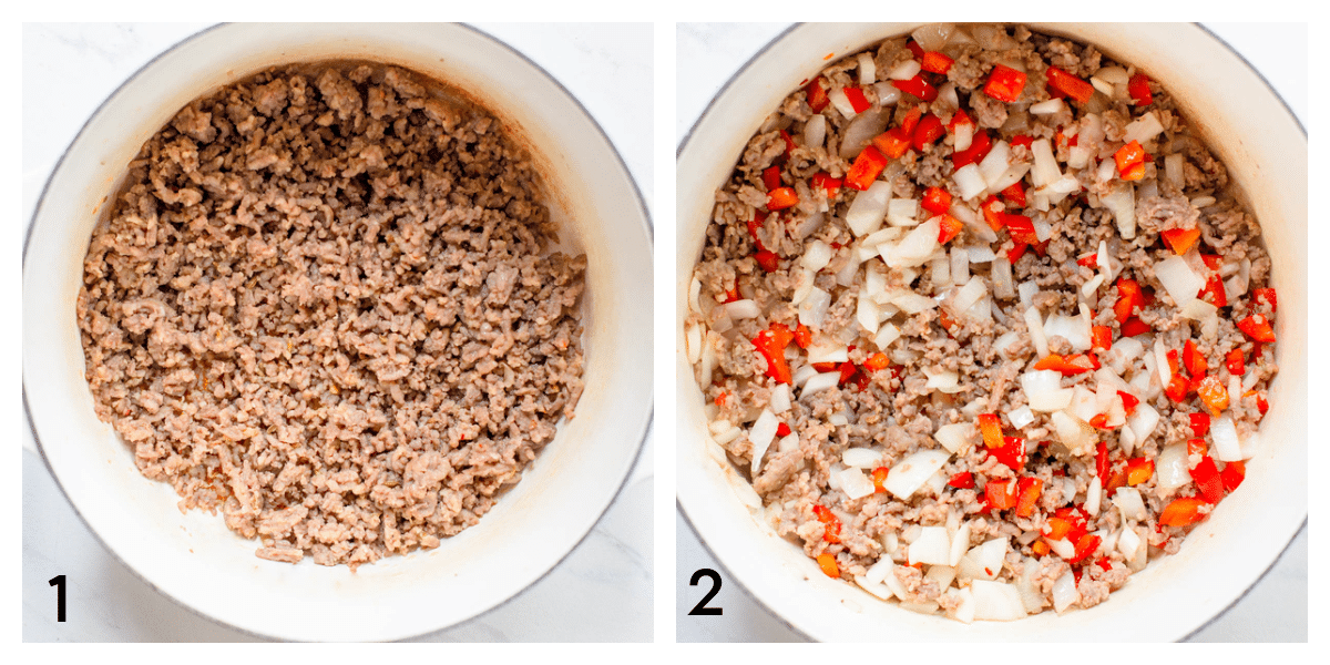 A white soup pot with ground sausage. A white soup pot with cooked ground sausage, diced onions, and diced red bell pepper.