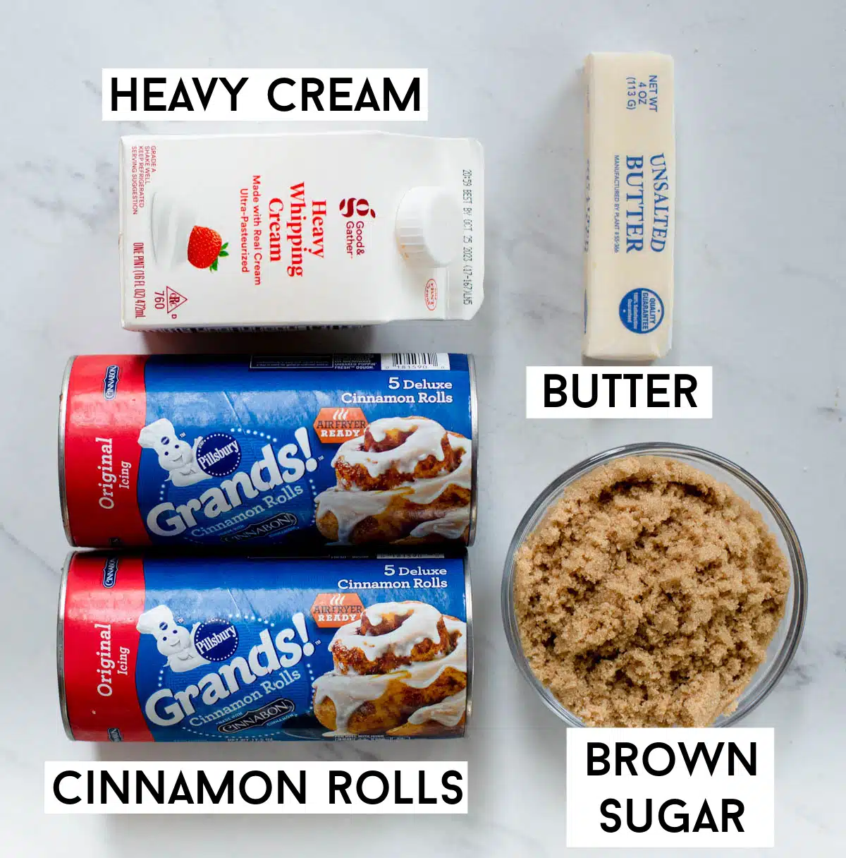 Ingredients in TikTok Cinnamon Rolls, including Grands cinnamon rolls, heavy cream, butter, and brown sugar. 