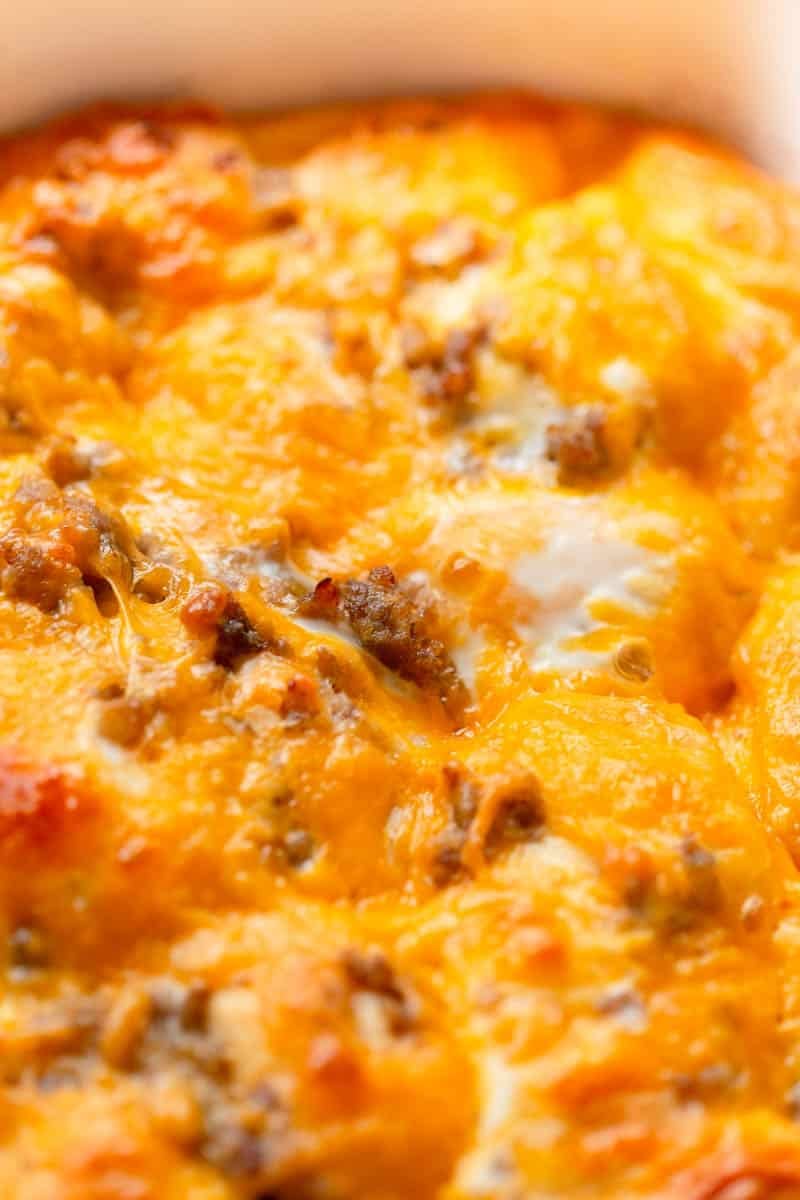 Sausage Egg Biscuit Casserole in a a white baking dish.