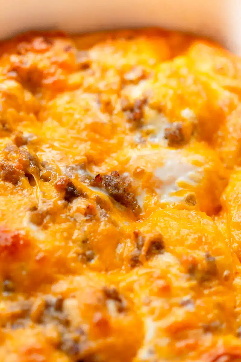Sausage Egg Biscuit Casserole in a a white baking dish. 