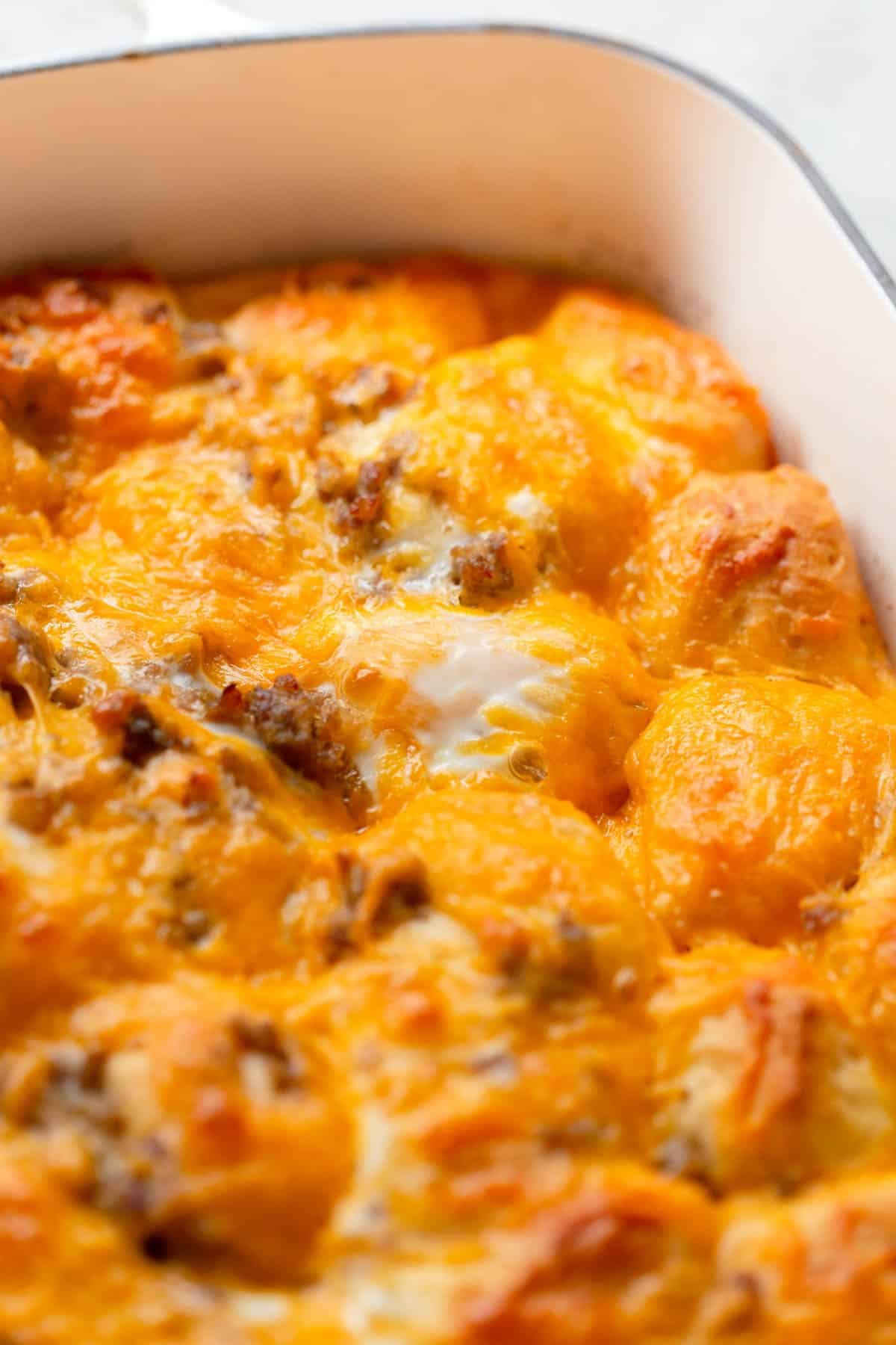 Sausage Egg Biscuit Casserole in a white baking dish.