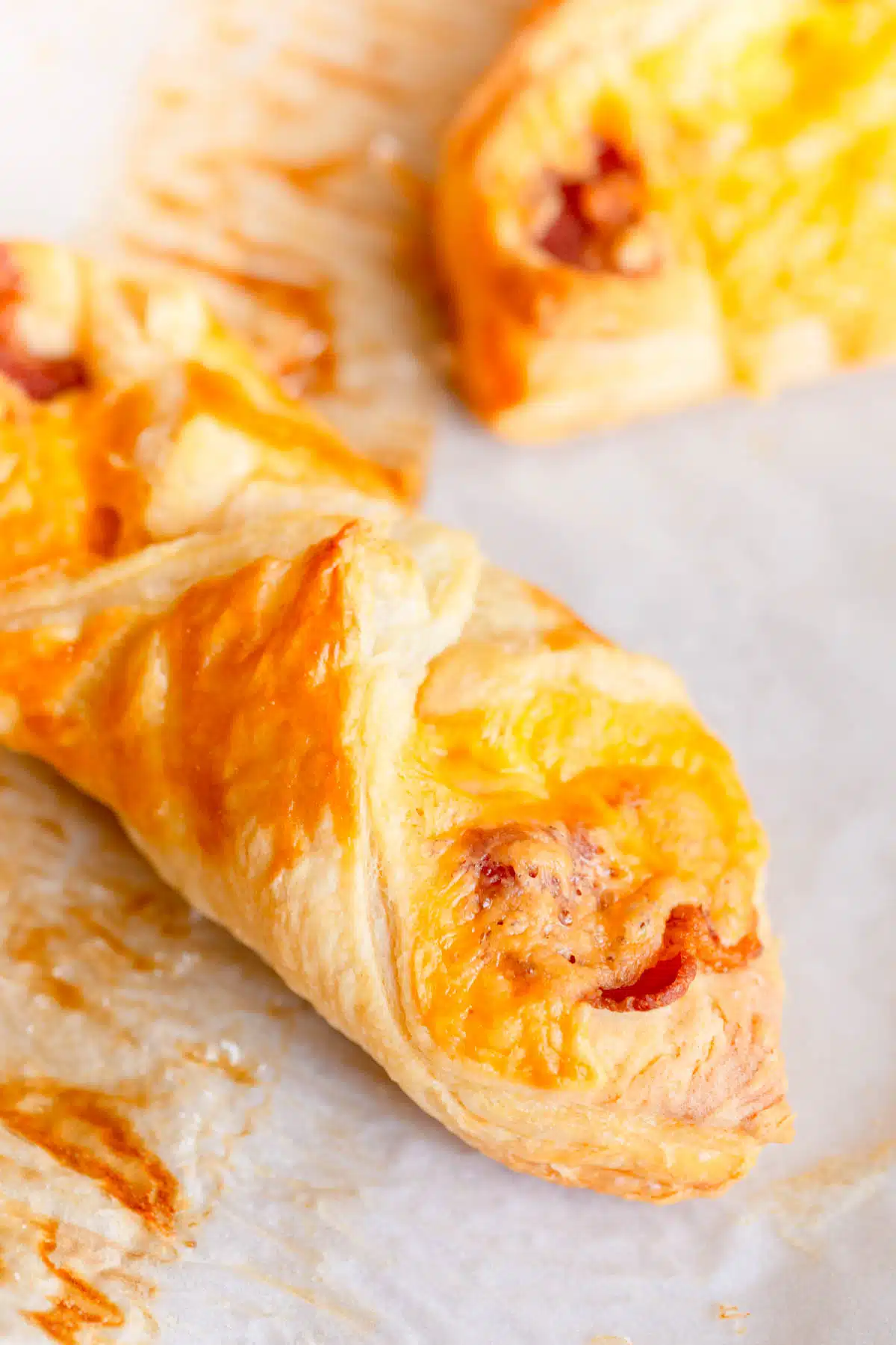 Bacon Cheese Turnover on parchment paper lined baking sheet. 