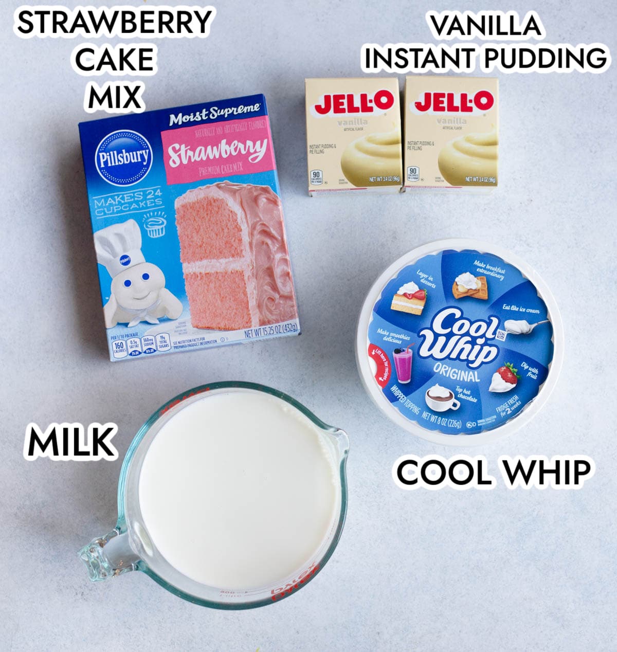 Ingredients in strawberry pudding poke cake including strawberry cake mix, vanilla instant pudding, cool whip, and milk. 
