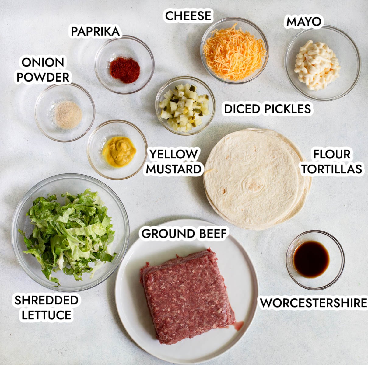 Ingredients in Smash Burger Tacos on a gray background. 