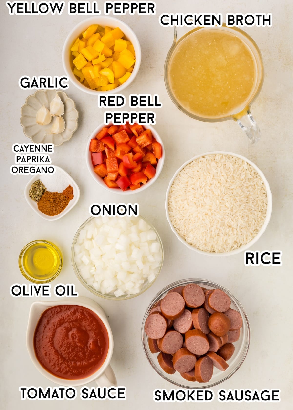 Ingredients in Cajun Sausage and Rice on a gray background. 