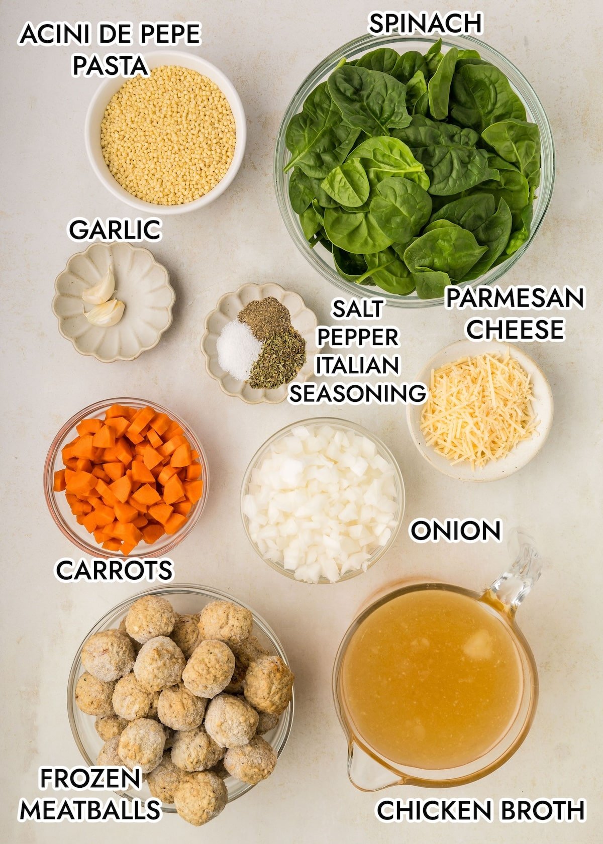 Ingredients in Slow Cooker Italian Wedding Soup on a gray background