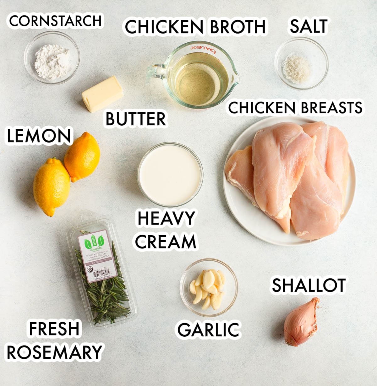 Ingredients in Slow Cooker Creamy Lemon Herb Chicken labeled with a gray background. 