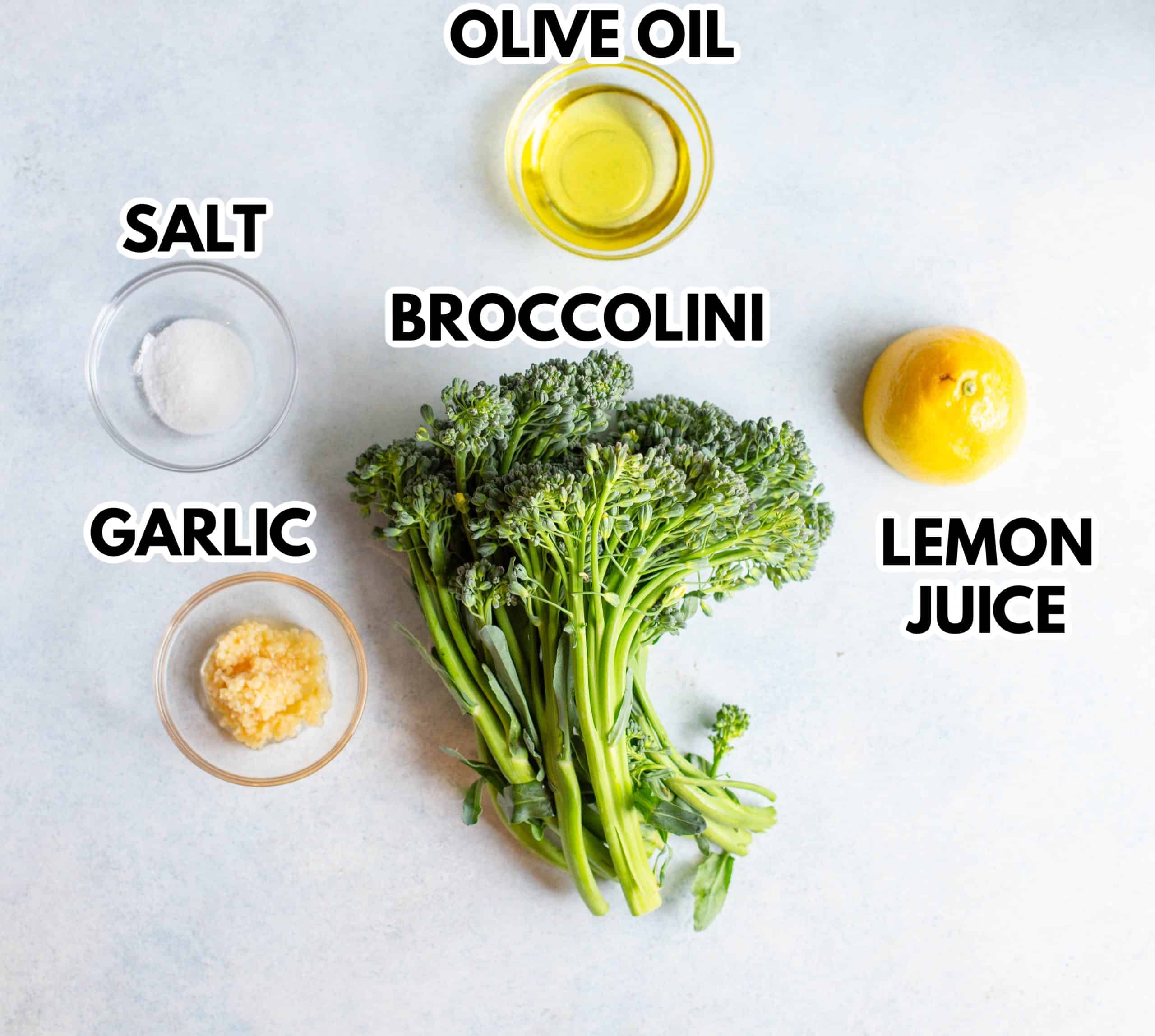 Ingredients in Air Fryer Broccolini with a gray background. 