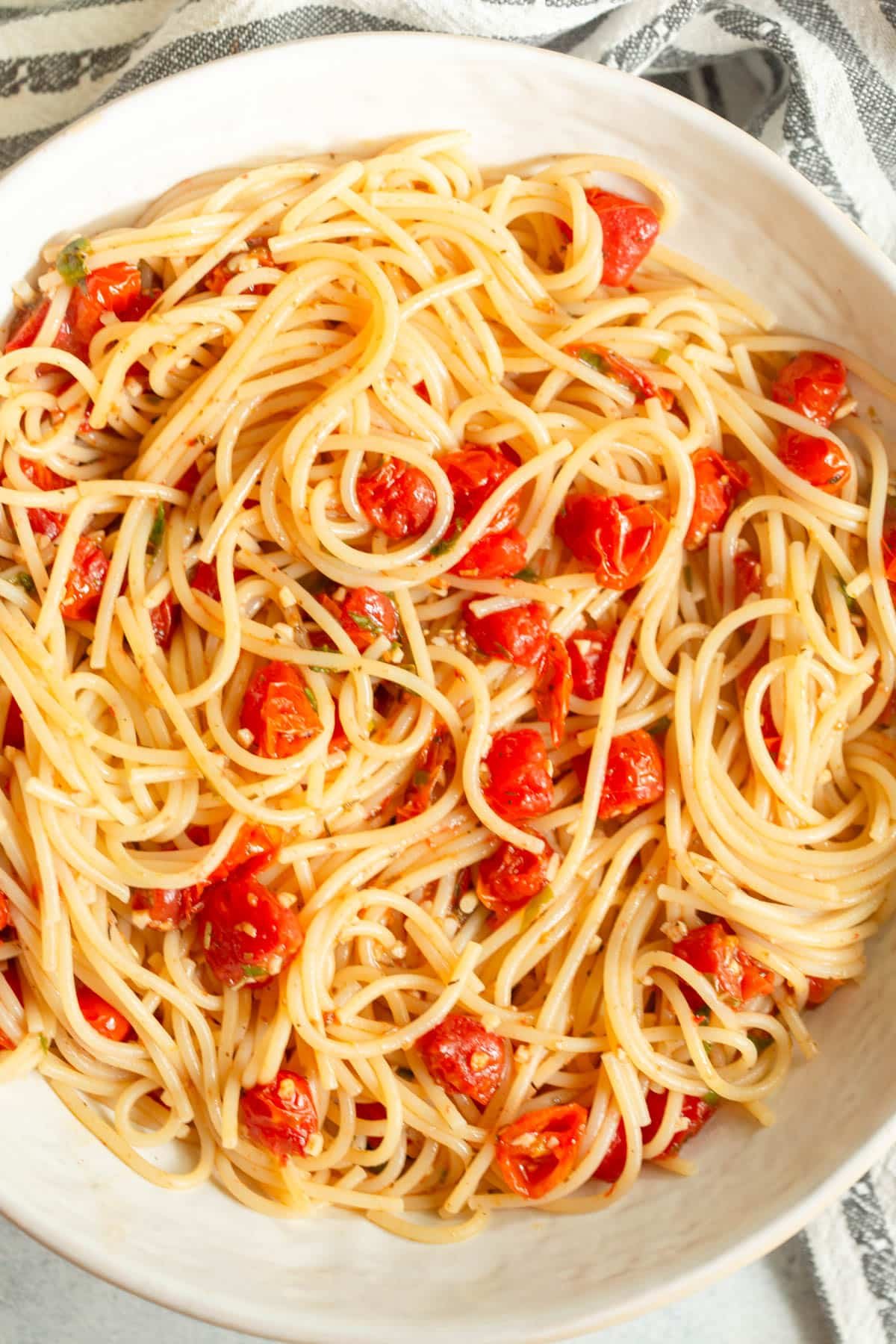 Roasted Tomato Pasta in a shallow cream colored bowl.