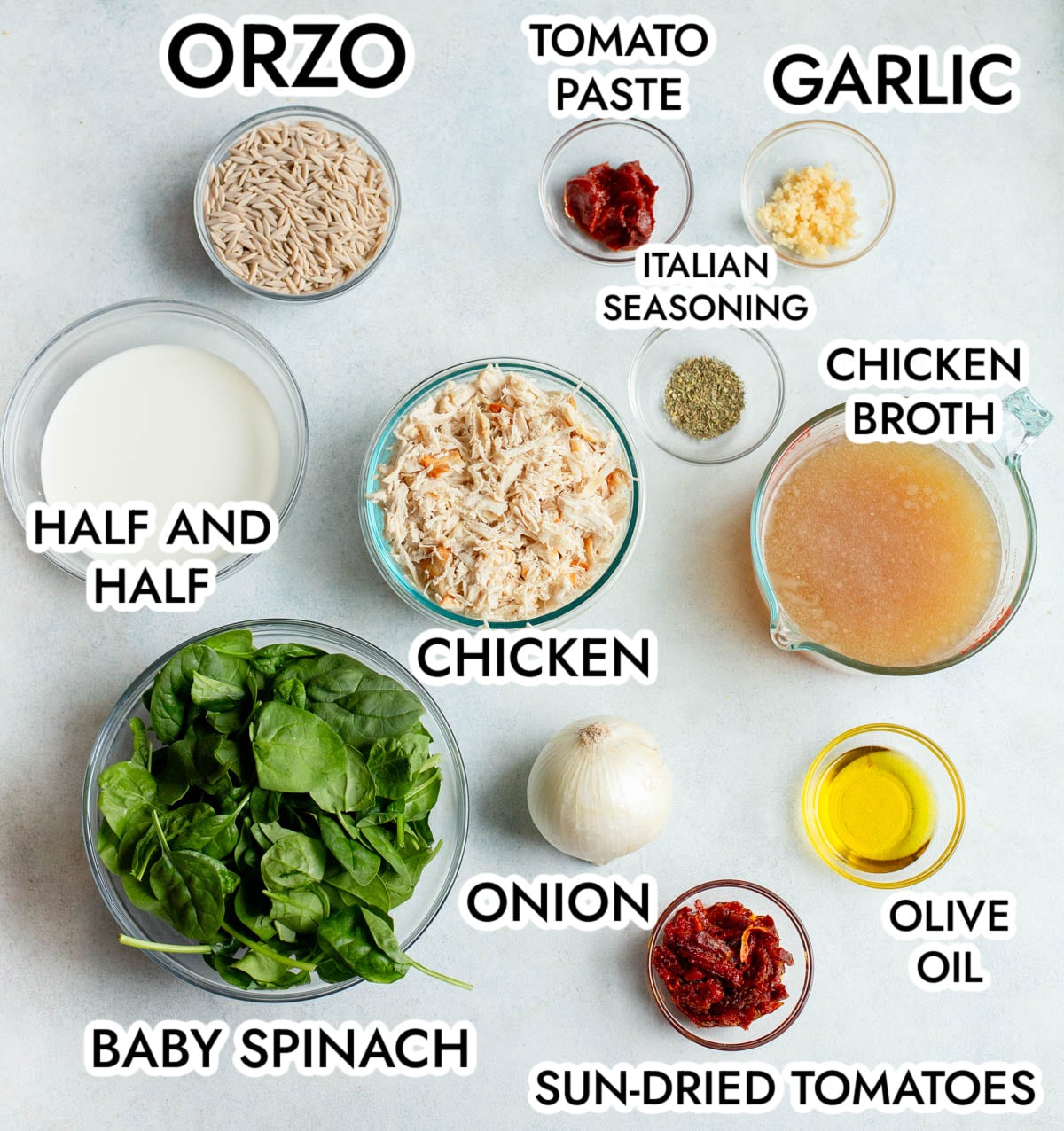 Ingredients in Marry Me Chicken Orzo Soup with a gray background.
