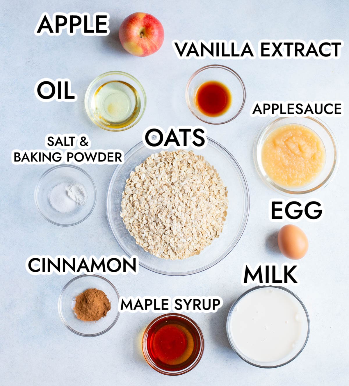 Ingredients in Applesauce Oatmeal bars on a gray background, labeled with black words. 