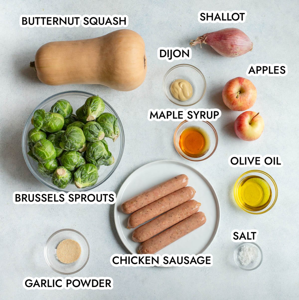 Ingredients in Sheet Pan Chicken Sausage and Veggies labeled with black text with a gray background 