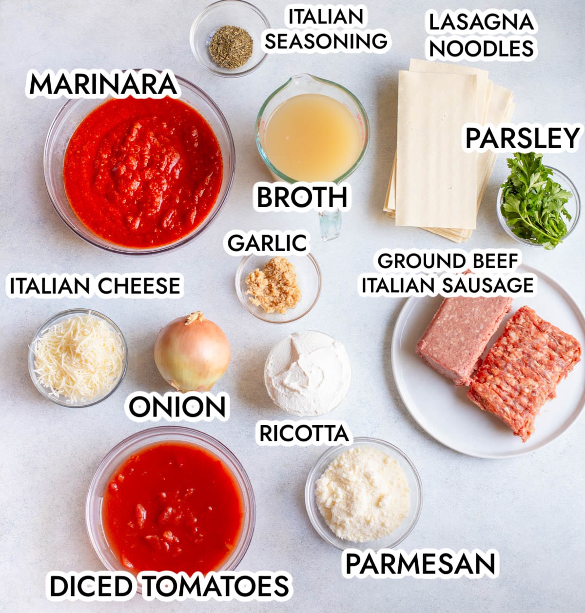 Ingredients in Slow Cooker Lasagna Soup on a gray background. 