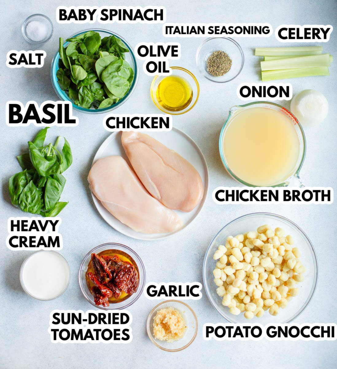 Ingredients in Slow Cooker Tuscan Chicken Soup with a gray background. 