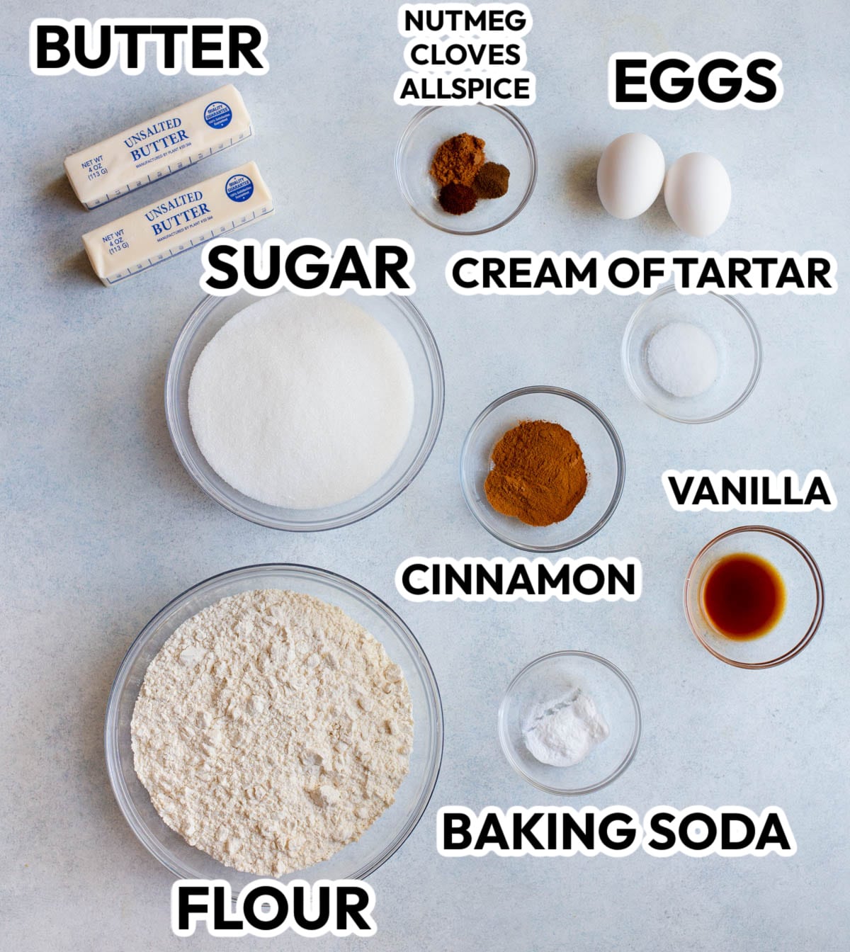 Ingredients in Apple Spice Snickerdoodles on a gray background with black labels. 