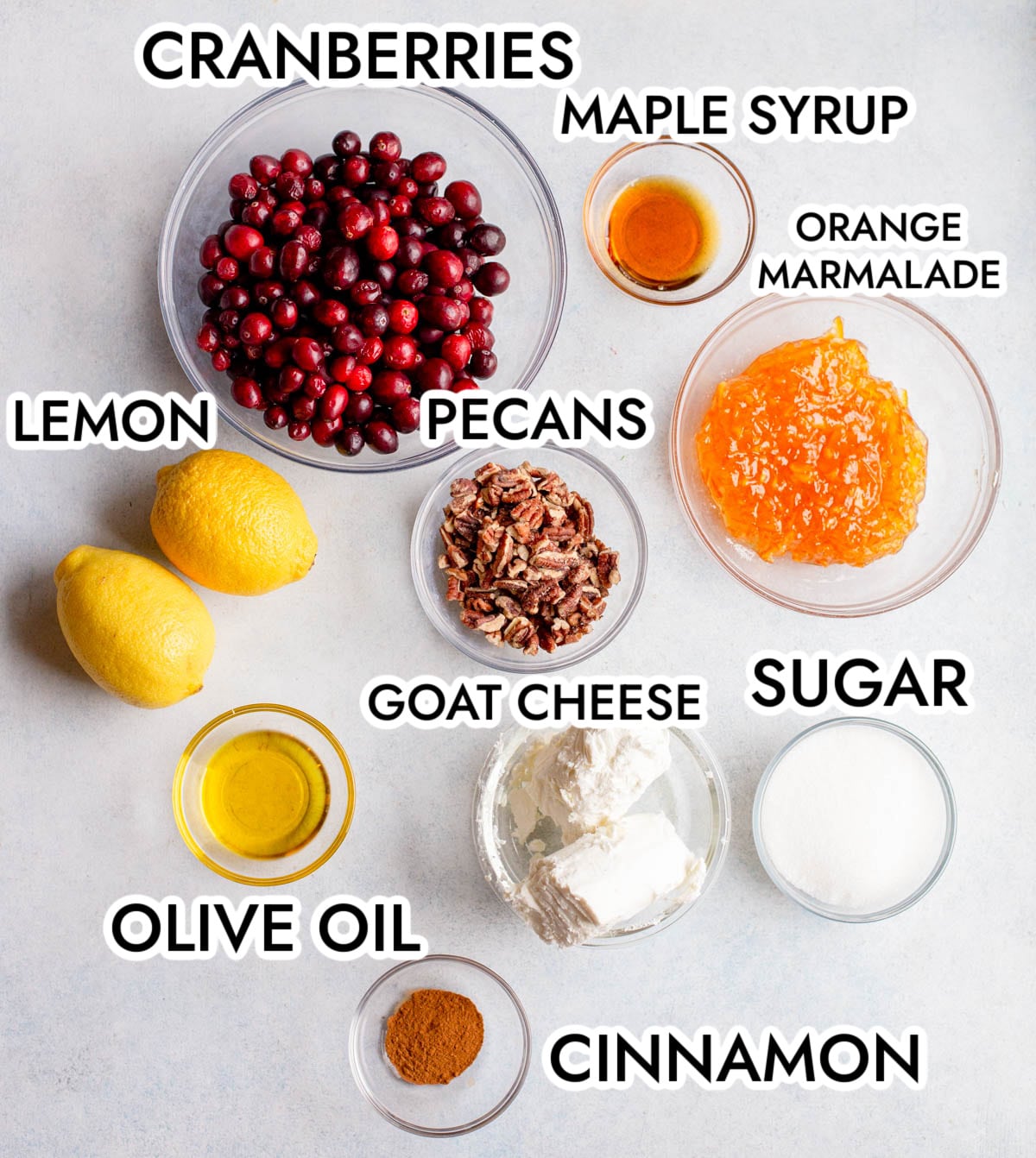 Ingredients for Whipped Goat Cheese with Cranberries on a gray background. 