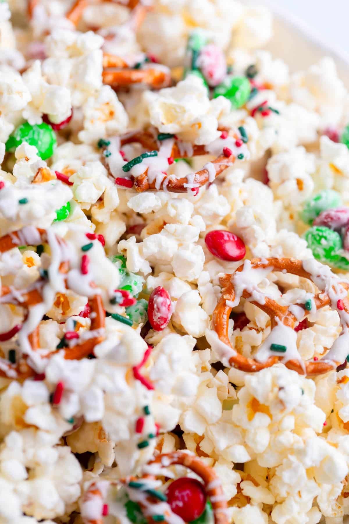 Christmas Popcorn in a white bowl.